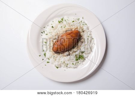 Cordon Bleu With Rice On A White Plate