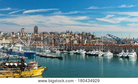 Genoa Liguria Italy - February 26 2017: Serene panoramic view of old port in Genoa the major Italian seaport on the Mediterranean Sea with cityscape of Genoa town.
