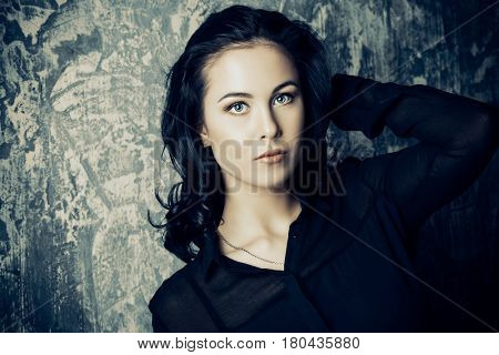Portrait of a beautiful young woman with brunette hair. Beauty, fashion concept. Cosmetics.