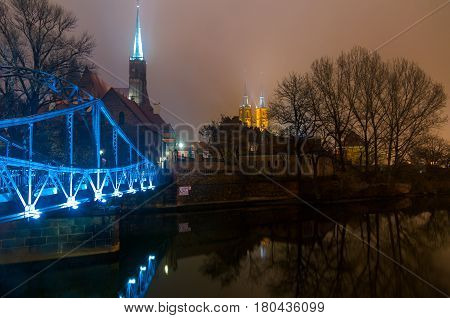 The Tumski bridge and Cathedral of St John Baptist at night Wroclaw Breslau Poland