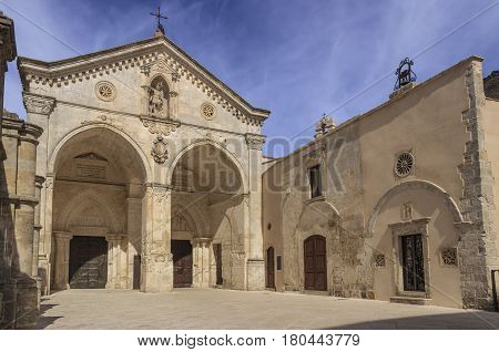 View of main facade of Saint Michael Archangel Sanctuary at Monte Sant'Angelo on Italy. Monte Sant'Angelo is a town on the slopes of Gargano promontory (Apulia).