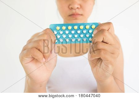 Woman with combined pills in hands,Woman healthcare concept and ideas