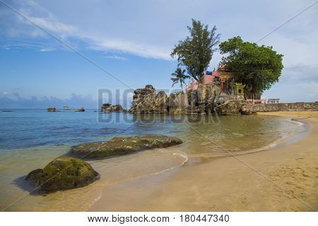 Phu Quoc, Vietnam - Mar 19, 2017: Phu Quoc island in a corner of a sunny day, far from the noise Dinh Cau temple, a famous religious view point on the island.