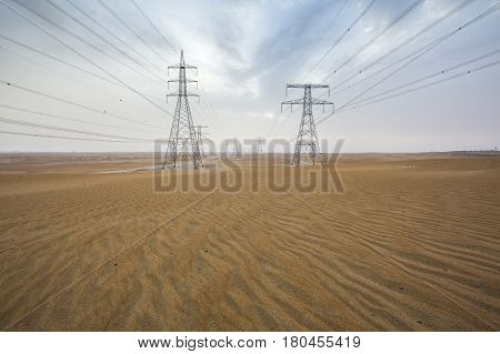 Power Line In A Desert Near Abu Dhabi