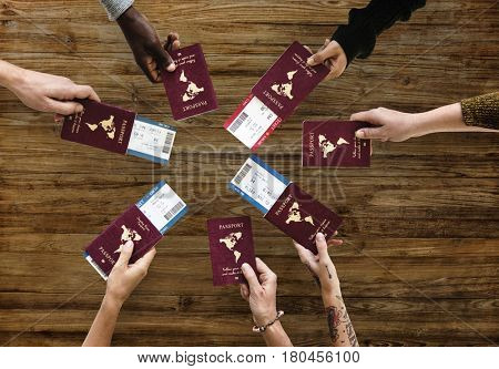 Group of Diverse Friendship Hands Show Passport with Plane Ticket