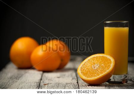 Orange Fruit Cut And Orange Juice On Wooden Table Background,
