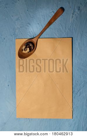 Quail Eggs In Wooden Spoons On Blue Textured Background