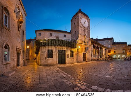 TROGIR CROATIA - SEPTEMBER 28 2015: Saint Sebastian Church and Trg Ivana Pavla II in Trogir Croatia. Trogir was founded in the 3rd century BC by Greek colonists from the island of Vis.
