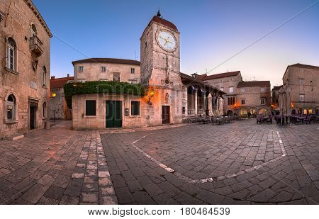 TROGIR CROATIA - SEPTEMBER 28 2015: Saint Sebastian Church and Trg Ivana Pavla II in Trogir Croatia. Trogir was founded in the 3rd century BC by Greek colonists from the island of Vis.