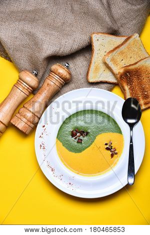 Spinach And Pumpkin Cream Soup With Fried Toast Bread