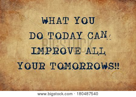 Inspiring motivation quote with typewriter text what you do today can improve all your tomorrows. Distressed Old Paper with Typing image.