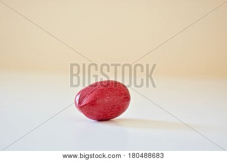 One red pecan on the white table