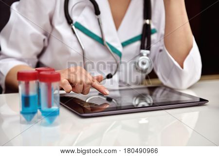 Famele Doctor With X-ray Of Patient