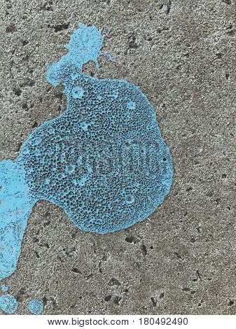 Bkue painted stain on concrete gray background