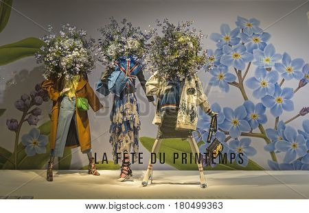 PARIS FRANCE - MARCH 27 2017: Mannequins in the showcase of the Printemps department store in Paris France. Spring and summer theme.