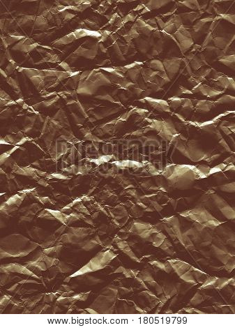 Abstract curve background with a texture of crumpled foil. Backdrop with crumpled brown material. Modern background of shiny paper sheet.