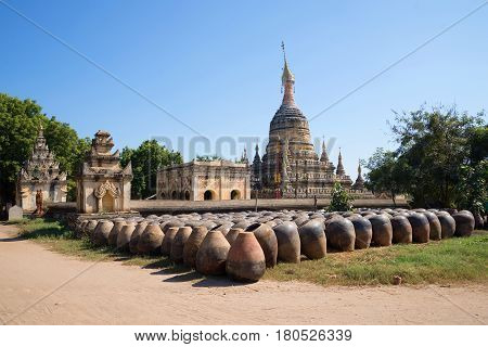 Large clay pots stacked at the ancient Buddhist temple of Hsu Taung Pyi. Bagan, Burma