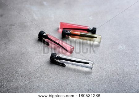 Perfume samples on gray background
