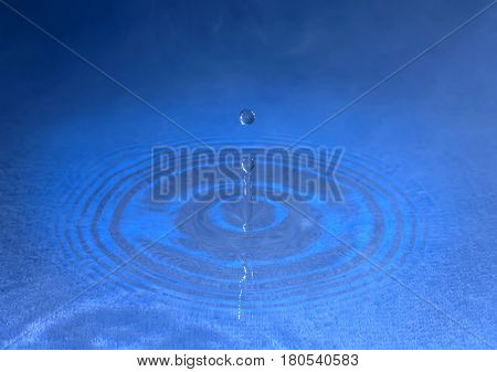 stiffened water drop falling on a water surface,In the fog