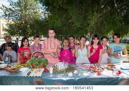 Veliko Tarnovo, Bulgaria - April 28.2016: Preparation for Easter. Children learn yes stained eggs for Easter
