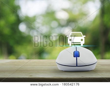 Car flat icon with wireless computer mouse over blur green tree in park Internet transportation service concept