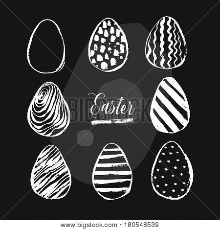 Hand drawn vector abstract Easter brush painted eggs collection set with floral motif in black and white colors isolated.Easter spring decoration background.Easter design elements.Eggs hunt concept.