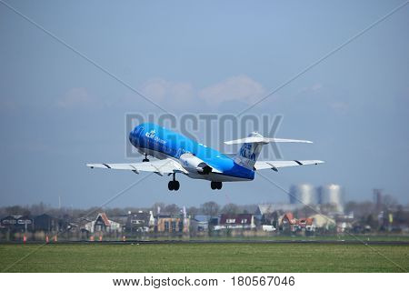 Amsterdam the Netherlands - April 2nd 2017: PH-KZP KLM Cityhopper Fokker F70 takeoff from Polderbaan runway Amsterdam Airport Schiphol