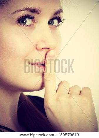 Woman Showing Silence Gesture With Finger