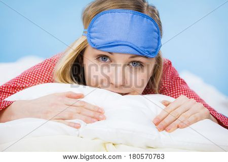 Young Woman Wearing Sleeping Eye Band In Bed