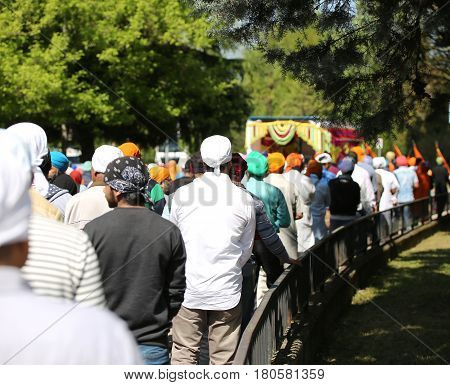 Vicenza, Vi, Italy - April 8, 2017: People Sikh Procession Pray During A Religious Nagar Kirtan Fest