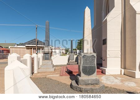 PHILIPPOLIS SOUTH AFRICA - MARCH 21 2017: Monuments for previous ministers in front of the Dutch Reformed Church in Philippolis the oldest town in the Free State Province