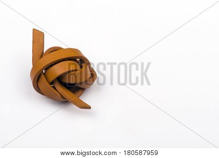 leather knot symbolizing the problems and stress, white isolated closep