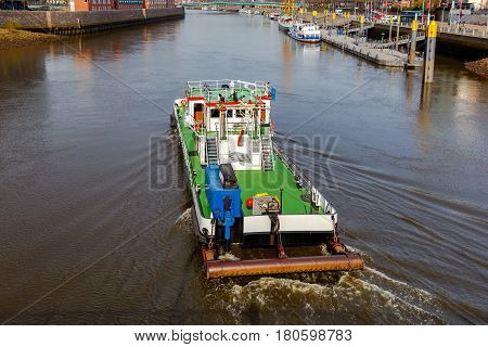 The river tugboat along the river Weser in the city of Bremen.