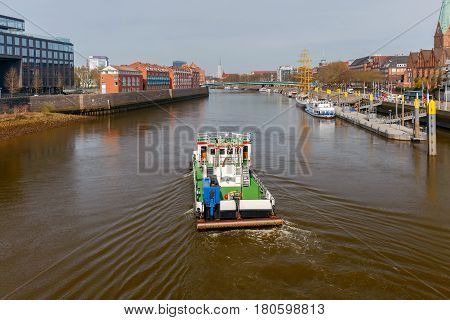 The river tugboat along the river Weser in the city of Bremen.