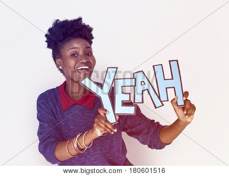 Smiling African Woman Holding Yeah Word