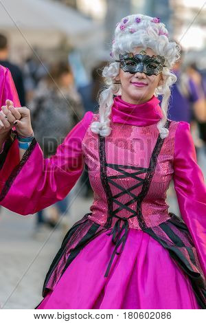 TIMISOARA ROMANIA - MARCH 31 2017: Woman on the street dressed in period costumes and present on the street inside the CheckART Carnival organized by the City Hall Timisoara.