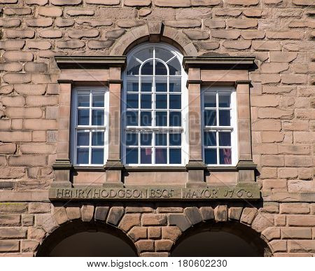 Window and inscription at the Town Hall Berwick upon Tweed.