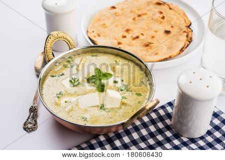 methi malai paneer or Creamy Fenugreek & Paneer Curry, popular north indian recipe prepared using milk cream, methi and paneer or cottage cheese, served with roti/paratha, selective focus