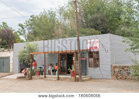 NIEU BETHESDA SOUTH AFRICA - MARCH 21 2017: A supermarket and several unidentified people in Nieu-Bethesda an historic village in the Eastern Cape Province