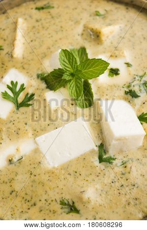 methi malai paneer or Creamy Fenugreek & Paneer Curry, popular north indian recipe prepared using milk cream, methi and paneer or cottage cheese, served with roti/paratha, selective focus