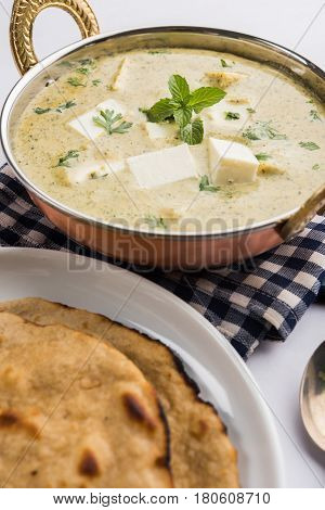 methi malai paneer or Creamy Fenugreek & Paneer Curry, popular north indian recipe prepared using milk cream, methi and paneer or cottage cheese, served with roti/paratha, selective focus