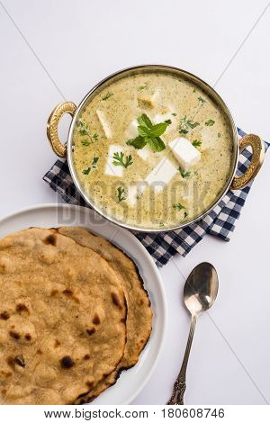 methi malai paneer or Creamy Fenugreek & Paneer Curry, popular north indian recipe prepared using milk cream, methi and paneer or cottage cheese, served with roti/paratha, selective focus
