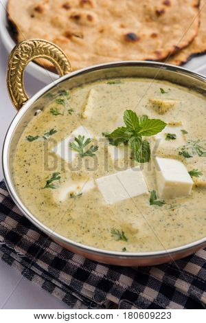 methi malai paneer or Creamy Fenugreek & Paneer Curry, popular north indian recipe prepared using milk cream, methi and paneer or cottage cheese, served with roti/paratha, selective focus