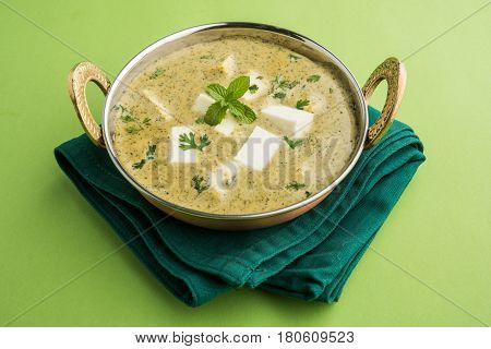methi malai paneer or Creamy Fenugreek & Paneer Curry, popular north indian recipe prepared using milk cream, methi and paneer or cottage cheese, served with roti/paratha, selective focus
