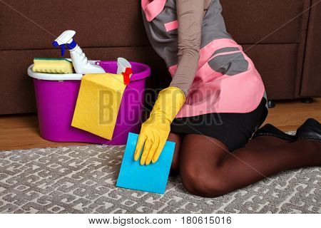 Female cleaning servisce worker asleep on a couch