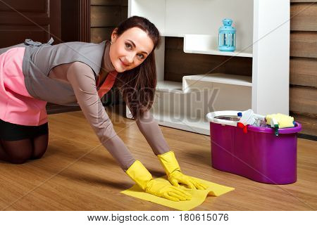Cleaning servisce worker wash the floor with rag