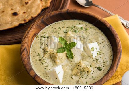 methi malai paneer or Creamy Fenugreek & Paneer Curry, popular north indian recipe prepared using milk cream, methi and paneer or cottage cheese, served with roti/paratha, selective focus