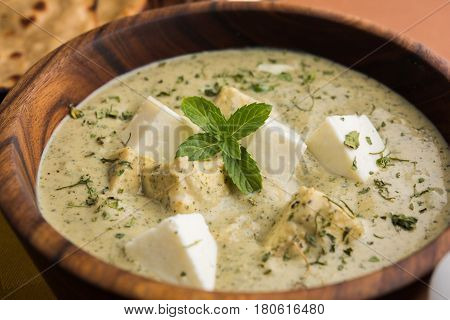 methi malai paneer or Creamy Fenugreek & Paneer Curry, popular north indian recipe prepared using milk cream, methi and paneer or cottage cheese, served with roti/paratha, selective focus