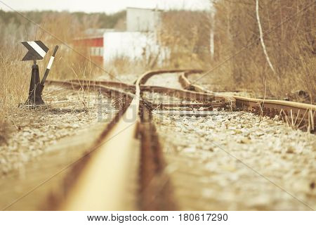 Manual railroad switch. Vintage rusty railroad landscape