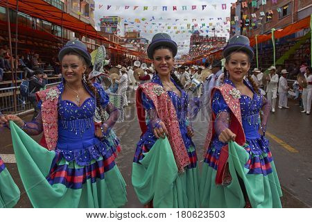 ORURO, BOLIVIA - FEBRUARY 26, 2017: Morenada dance group in colourful outfits parading through the mining city of Oruro on the Altiplano of Bolivia during the annual Oruro Carnival.